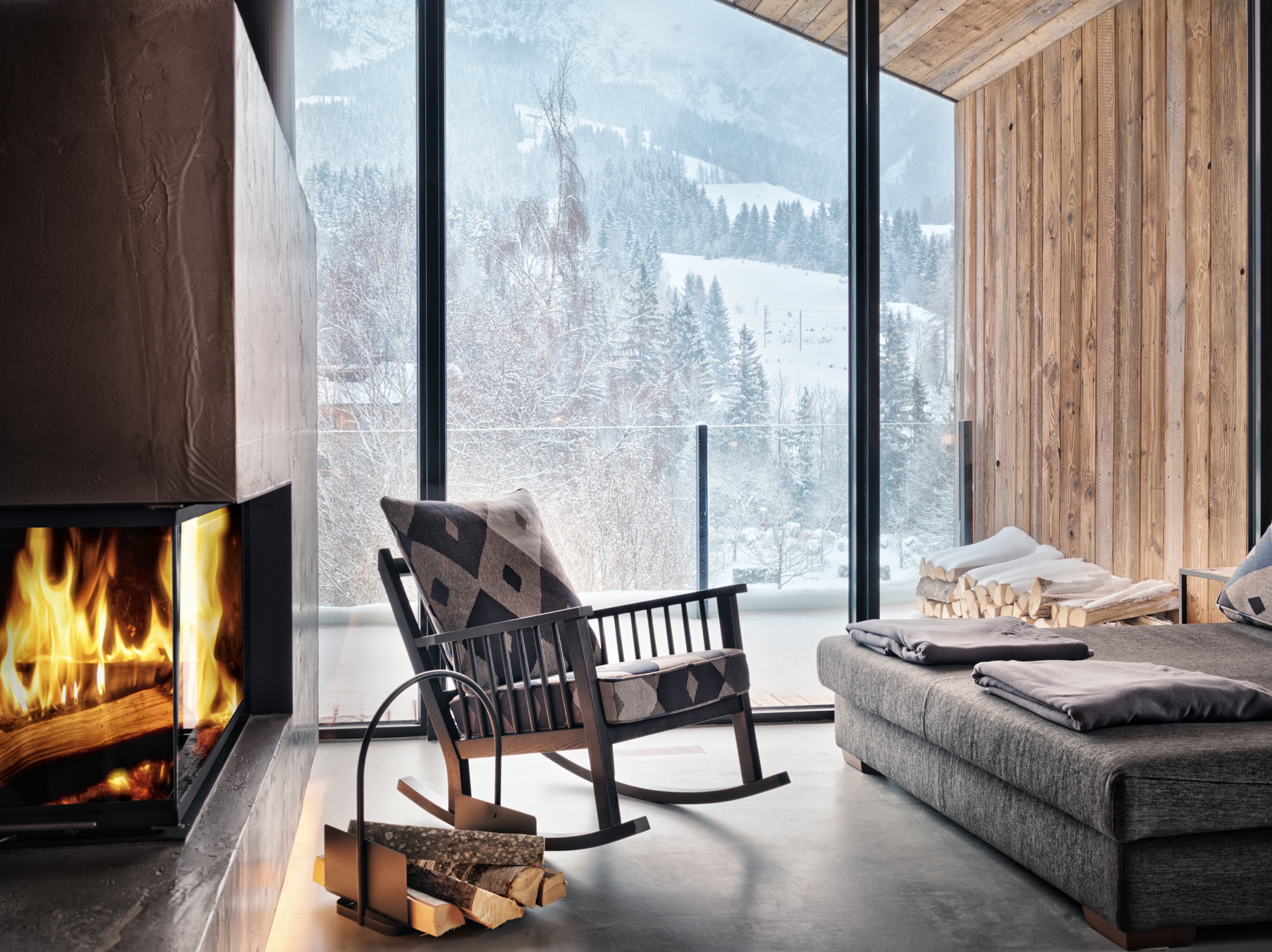 Indoor lounge with fireplace at the Austrian Nature Escape