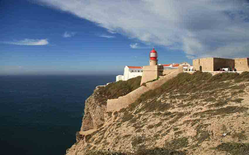 Lighthouse in Algarve with The Little Voyager