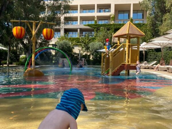 Child playing at the paddle pool at Sani Club