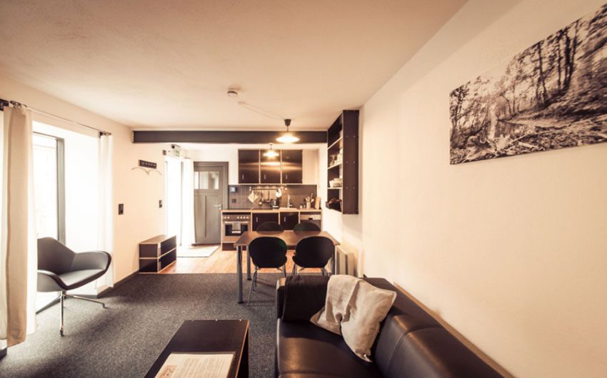 German Farmhouse Apartments Living Room with The Little Voyager