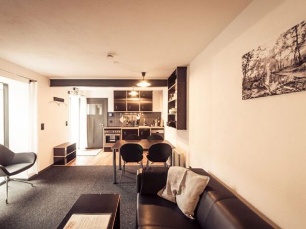 German Farmhouse Apartments Living Room with The Little Voyager