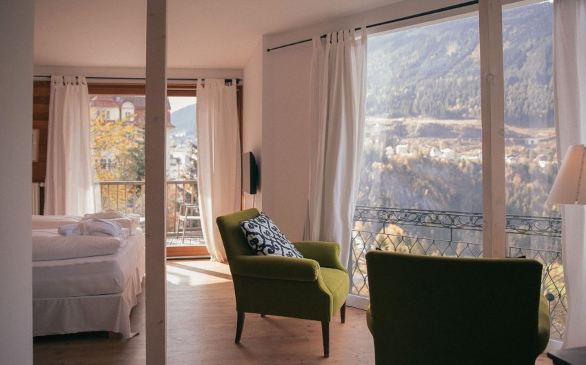 bed and armchair in alpine suite