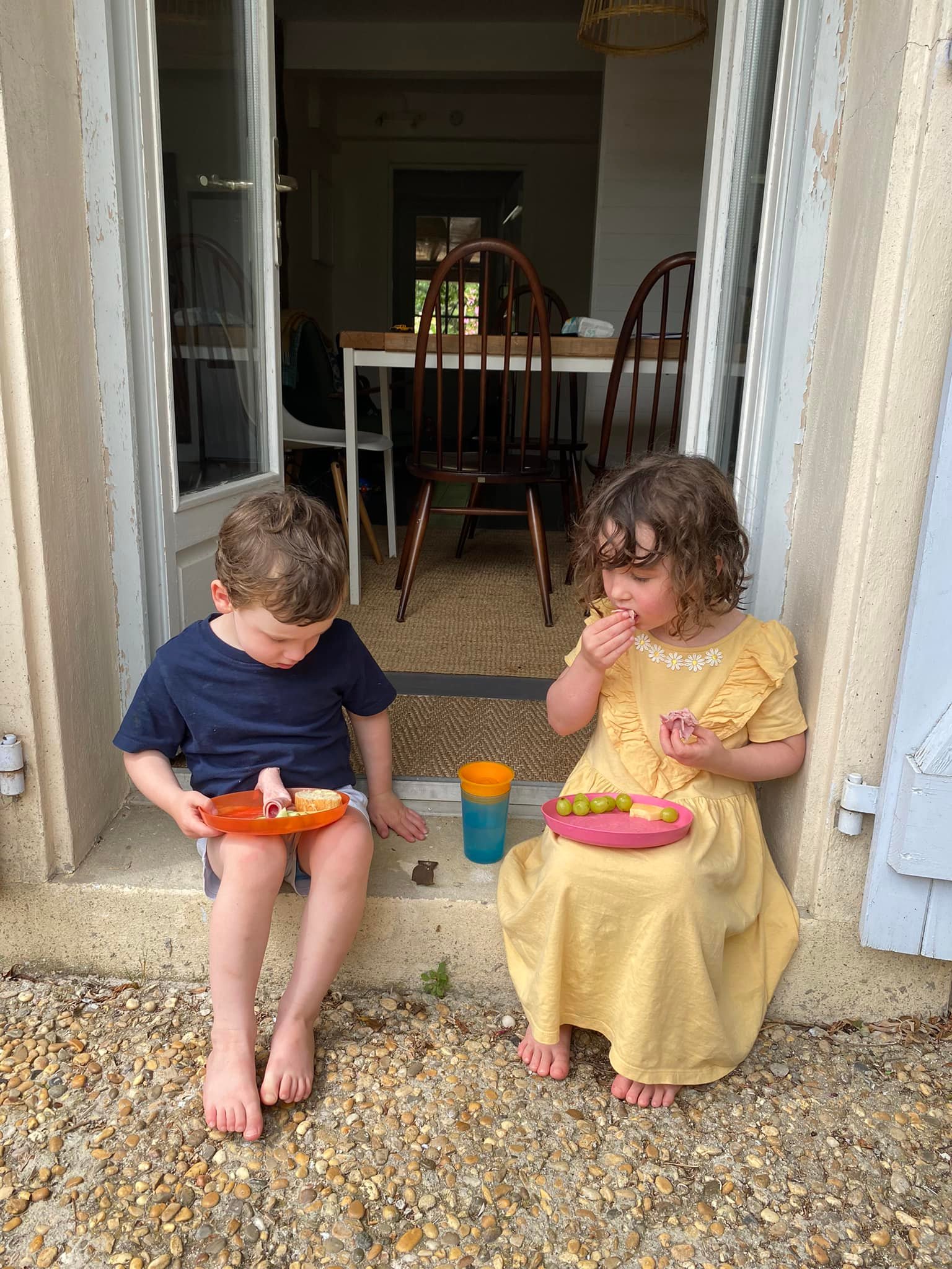Kids eating outside cottage at the French gites