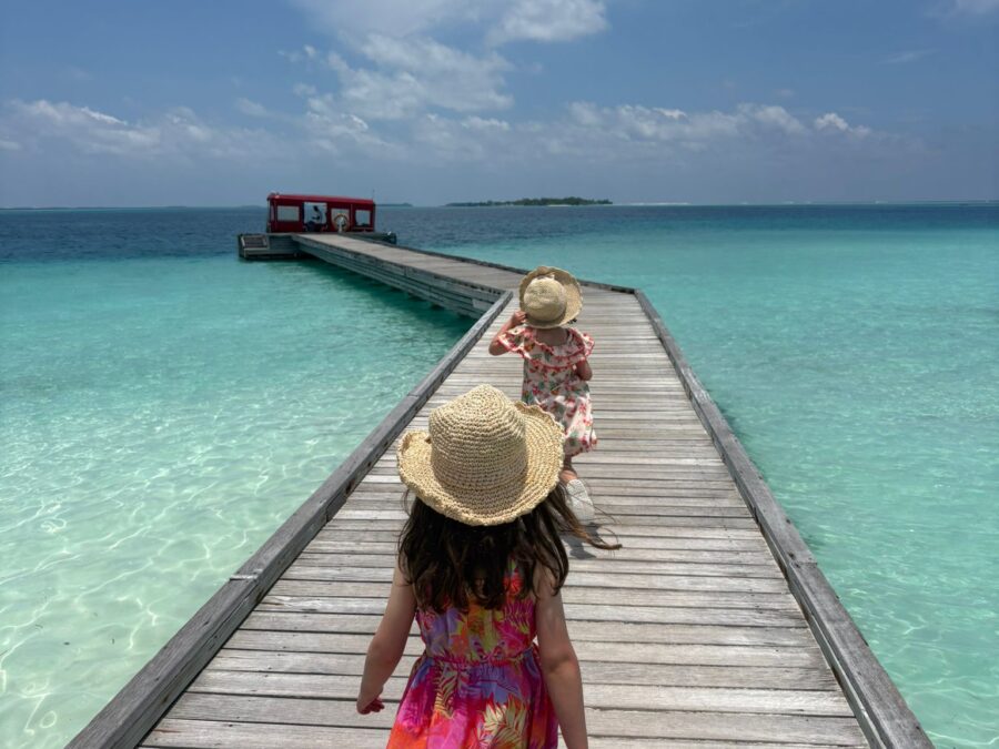 Girls walking on pier Niyama Private Islands April 2026