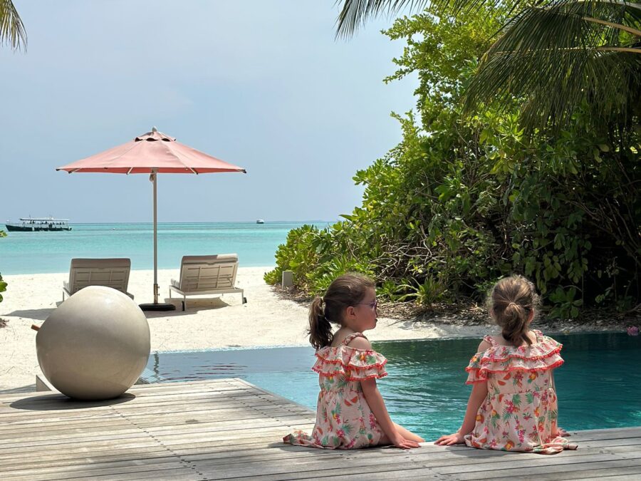 Girls sitting by private pool at Niyama Private Islands