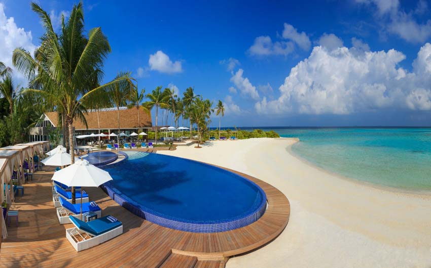 Niyama Private Islands Beach Pool with The Little Voyager