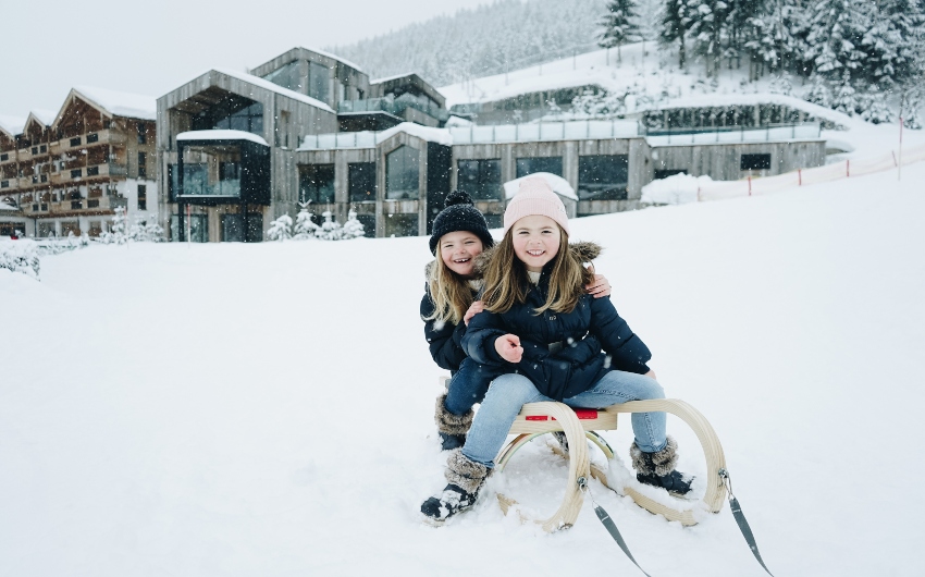 Girls on sleigh at Hotel Forsthofgut