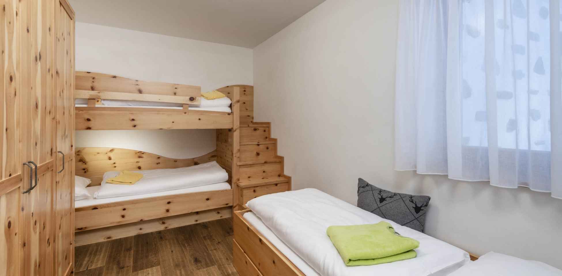 Bunk beds inside Chalet at the South Tyrolean Nature Resort