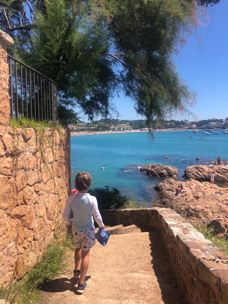 Boy walking along coastline path on the Costa Brava