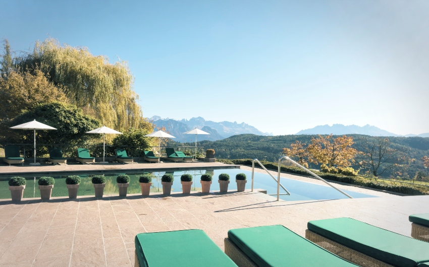 Outdoor pool in Autumn at the South Tyrolean Art Nouveau Hotel