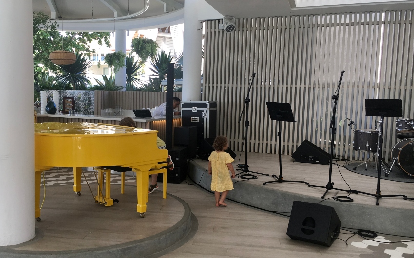 chlildren playing close to stage at a restaurant LUX* Grand Gaube