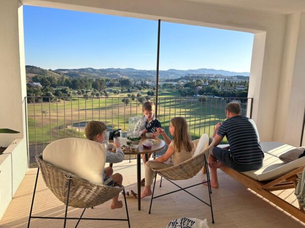 Kids sitting on balcony at La Zambra
