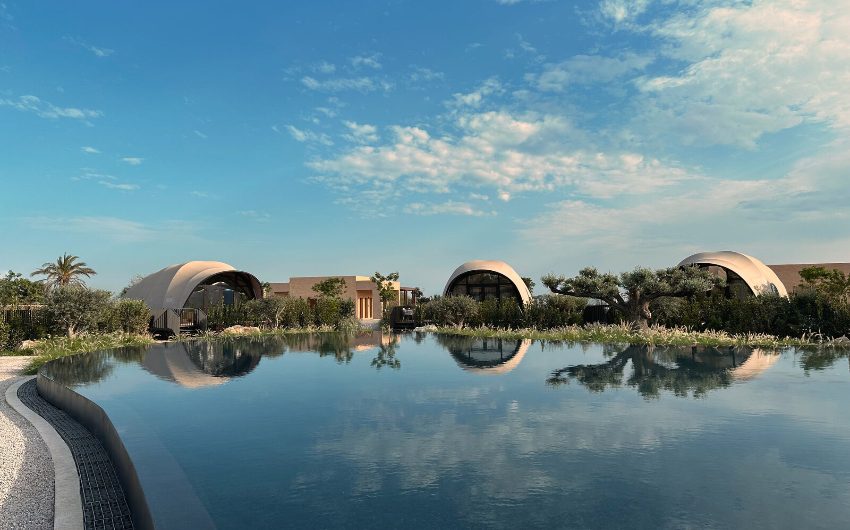 Cabanas reflected on lake at 91 Athens Riviera