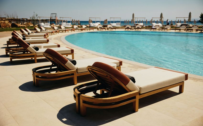 Pool and sunloungers at 91 Athens Riviera