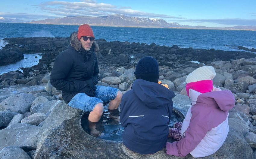 children with father on a family holiday in Iceland