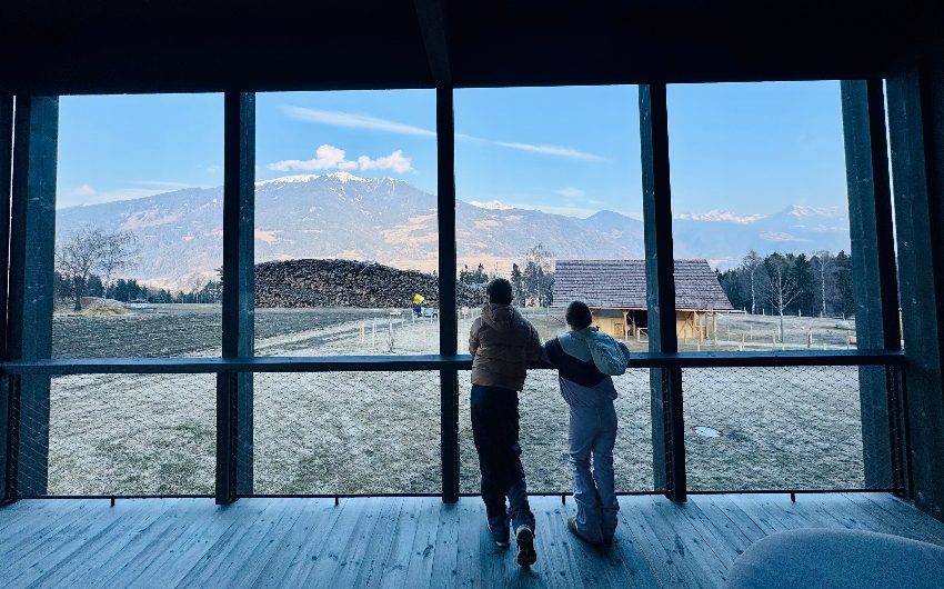 Kids looking out of window at AKI Family Resort PLOSE