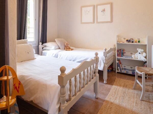 two single beds in a kid's room