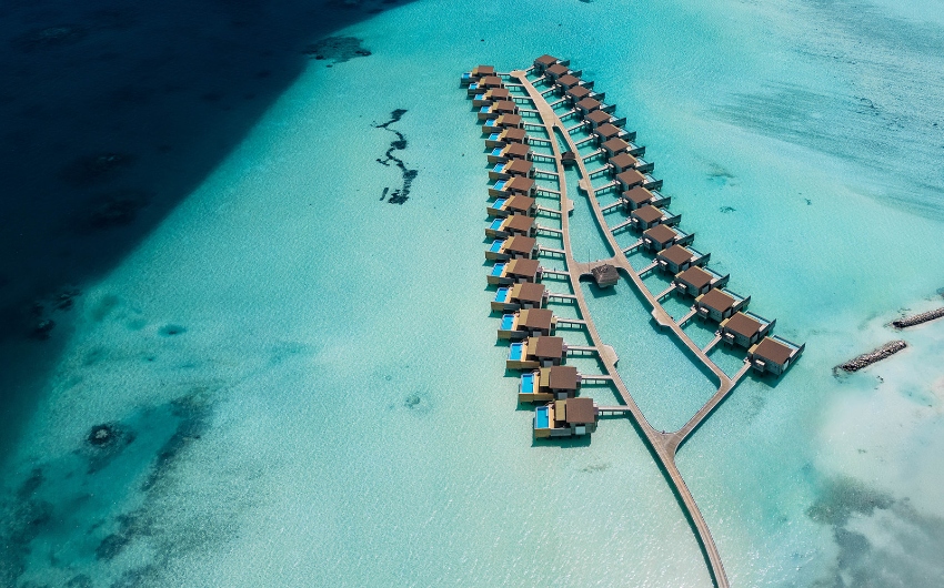 Aerial view of water villas at Kuda Villingili Resort