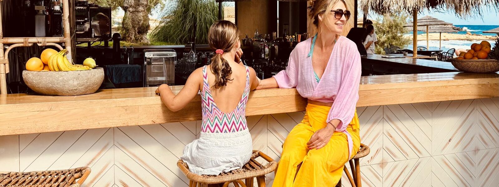 Uma and Ilonka sitting at the beach bar at the Cretan Eco Resort