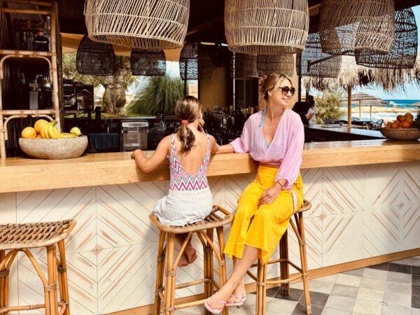 Uma and Ilonka sitting at the beach bar at the Cretan Eco Resort